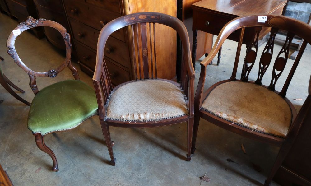 Two Edwardian inlaid mahogany tub shaped elbow chairs and a Victorian walnut salon chair
